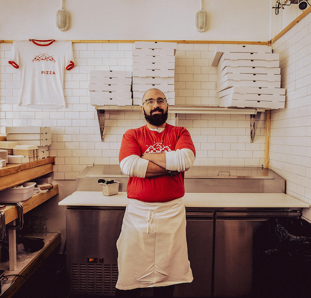 Portrait of chef in pizzeria