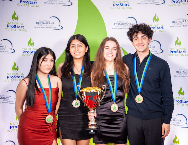 Four students from Wilbur Cross High School, New Haven, Connecticut, who won first place in the NPSI Management Compettiion