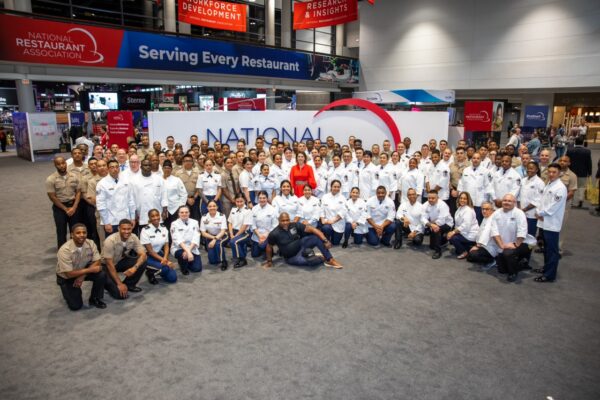Photo of Advanced Management Training Program participants at the National Restaurant Association booth
