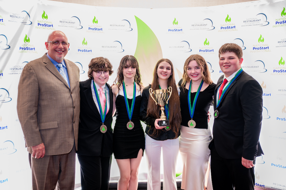 Photo of the students and educator of the NPSI 2024 2nd place Culinary team from Herndon Career Center, Raytown, Mo.