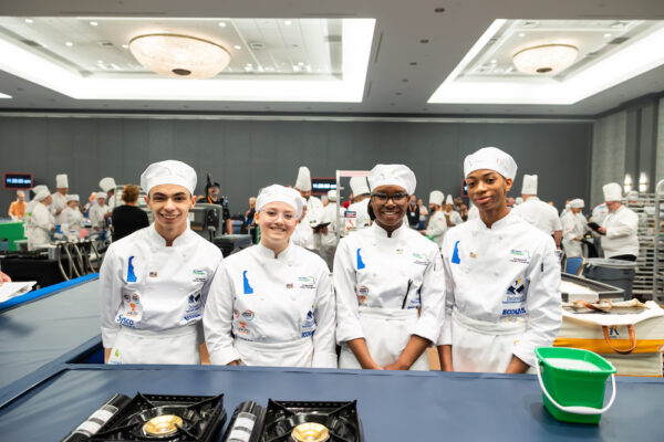 Four culinary students of the first place team from Caesar Rodney High School, Camden, Delaware